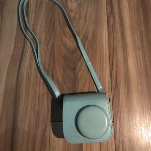 Fujifilm instead Polaroid camera and carry case. Teal blue. Mini 9